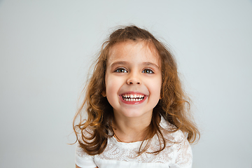 Image showing Pretty caucasian girl portrait isolated on white studio background with copyspace