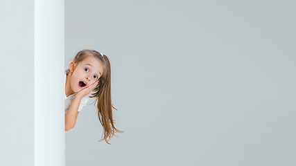 Image showing Pretty caucasian girl portrait isolated on white studio background with copyspace