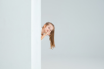 Image showing Pretty caucasian girl portrait isolated on white studio background with copyspace