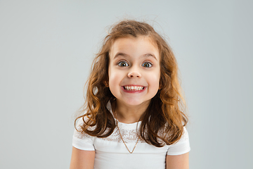 Image showing Pretty caucasian girl portrait isolated on white studio background with copyspace