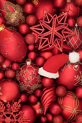 Image showing Christmas Santa Hat and Red and Gold Bauble Background