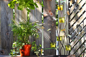 Image showing Flower pots and decorations on house deck