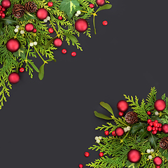 Image showing Christmas Background with Red Ball Baubles and Winter Greenery 