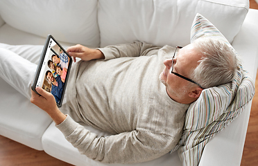 Image showing senoir man having video call with family