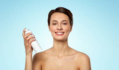 Image showing beautiful young woman with hair spray or mist