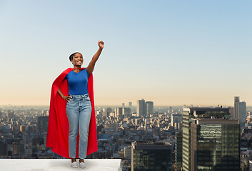 Image showing happy african american woman in red superhero cape