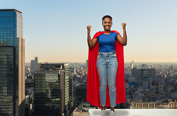 Image showing happy african american woman in red superhero cape