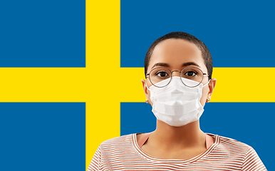 Image showing woman in protective mask over flag of sweden