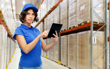 Image showing delivery girl with tablet pc at warehouse