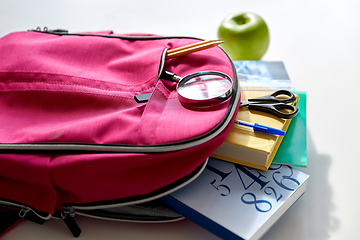 Image showing backpack with books, school supplies and apple