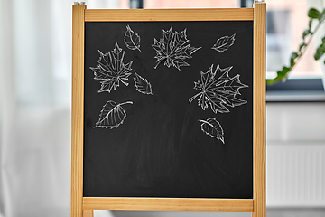 Image showing autumn leaves drawn with chalk on black chalkboard