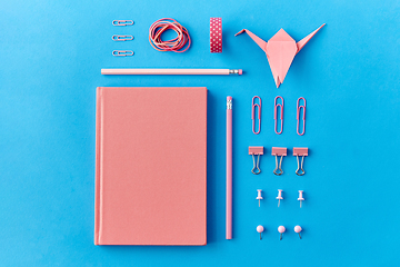 Image showing pink notebook, pins, clips, pencils and rubbers