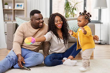 Image showing african family playing with baby daughter at home