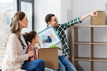 Image showing happy family with child moving to new home