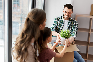 Image showing happy family with child moving to new home