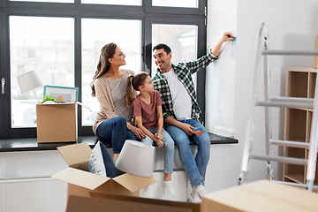 Image showing happy family with color palette moving to new home