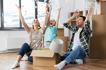 Image showing happy family playing with foam peanuts at new home