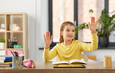 Image showing student girl touching something imaginary at home