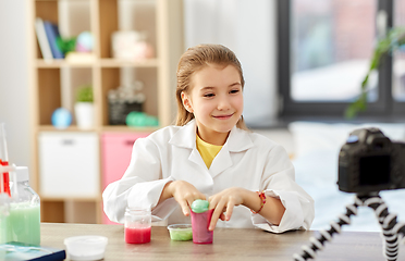 Image showing girl with slime and camera video blogging at home