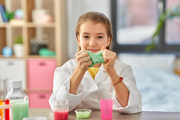 Image showing girl playing with slime at home laboratory