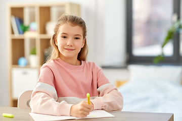 Image showing girl with notebook and marker drawing at home