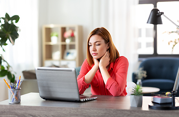 Image showing bored woman with laptop working at home office