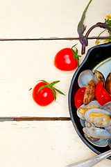 Image showing fresh clams on an iron skillet