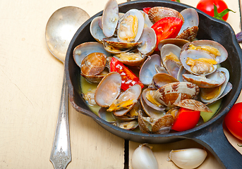 Image showing fresh clams on an iron skillet