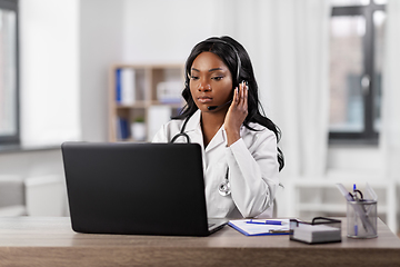 Image showing african doctor with headset and laptop at hospital