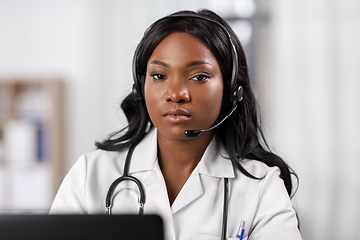 Image showing african doctor with headset and laptop at hospital