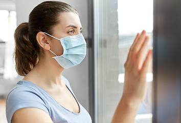 Image showing sick young woman wearing protective medical mask