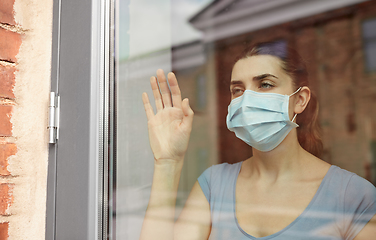 Image showing sick young woman wearing protective medical mask