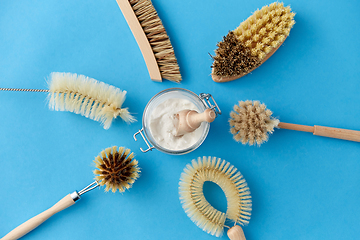 Image showing cleaning brushes and soda powder with scoop in jar