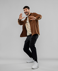 Image showing happy smiling young man with mustaches