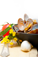 Image showing fresh clams on an iron skillet