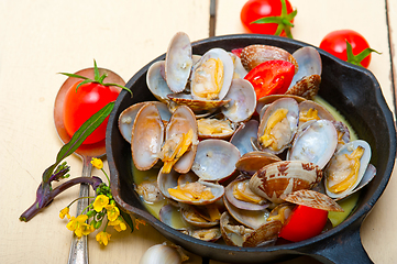 Image showing fresh clams on an iron skillet