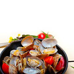 Image showing fresh clams on an iron skillet