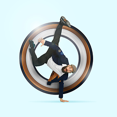 Image showing Businessman having fun dancing break dance on blue background at work