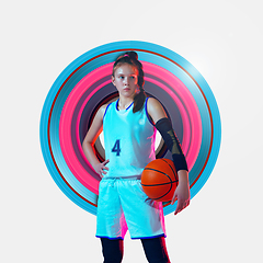 Image showing Full length portrait of a female basketball player with ball