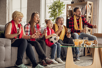 Image showing Excited, happy big family team watch football, soccer match together on the couch at home