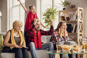 Image showing Excited, happy big family team watch football, soccer match together on the couch at home