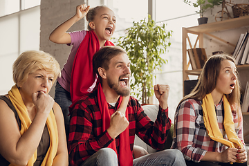 Image showing Excited, happy big family team watch football, soccer match together on the couch at home