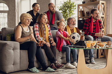 Image showing Excited, happy big family team watch football, soccer match together on the couch at home