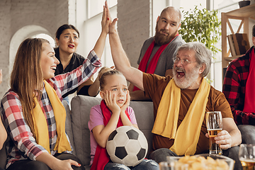 Image showing Excited, happy big family team watch football, soccer match together on the couch at home