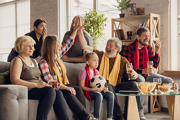 Image showing Excited, happy big family team watch football, soccer match together on the couch at home