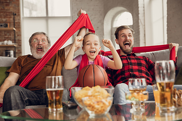 Image showing Excited, happy big family team watch sport match together on the couch at home