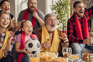 Image showing Excited, happy big family team watch football, soccer match together on the couch at home