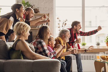 Image showing Excited, happy big family team watch football, soccer match together on the couch at home