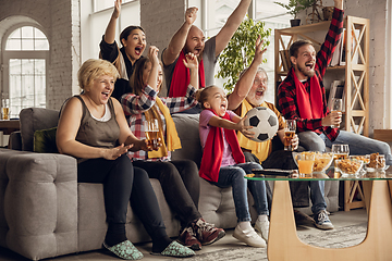 Image showing Excited, happy big family team watch football, soccer match together on the couch at home