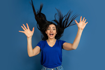 Image showing Caucasian woman\'s portrait isolated on blue studio background